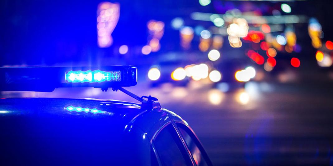 A police car with its siren on